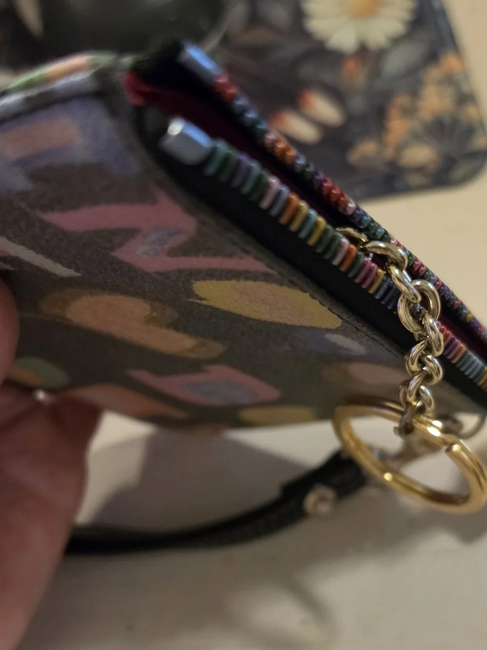 Dooney & Bourke Vintage multicolor letter/graffiti print coated Wristlet